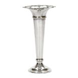 A trumpet shaped silver stem vase, with a flared neck and weighted base,