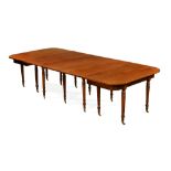 A George III mahogany dining table, comprising a pair of D ends,