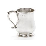 A Georgian silver tankard, hallmarked Dublin the other marks rubbed, with central engraved crest.