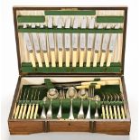 An oak canteen of silver plated cutlery, by Dixon Sheffield, six place settings.