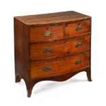 An early 19th century mahogany boxwood and ebony strung bowfronted chest of drawers,