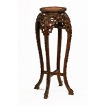 A Chinese hardwood rouge marble topped jardiniere stand. Height 90 cm, diameter 28 cm.