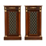 A pair of Regency style rosewood pedestal cupboards, with rear doors,