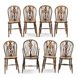 A set of eight ash and elm Windsor chairs, to include one carver,