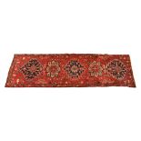 A fine hand knotted Iranian Heriz runner, 3.4 m x 1.04 m.