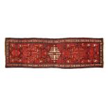 An eastern runner with multiple line border, principal colours beige, blue and red. 320 cm x 97 cm.