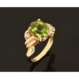 A 14 ct yellow gold green stone and diamond set ring, stamped 14 K Size O.