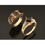 A 9 ct gold dress ring with ruby coloured stone,