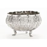 A Far Eastern white metal bowl, with embossed figural and foliate decoration. Diameter 9.5 cm.