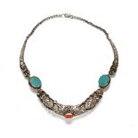 A vintage Tibetan silver coloured metal dragon necklace. (see illustration).