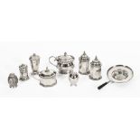 A quantity of hallmarked silver, to include condiments, mustards and a tea strainer (9).