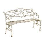 A Victorian cast iron branch form garden bench.