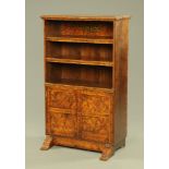 A burr walnut bookcase and combined cupboard,