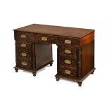 An Anglo Indian Padouk wood pedestal desk, with egg and dart moulded edge,