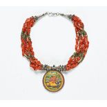 A Tibetan amber necklace, with miniature painting of Ganesh. Diameter 5 cm.