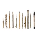 A collection of brass, silver and plated Victorian and later pens and pencils,