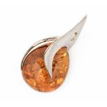 A Jenny Jones silver mounted amber pendant, height 8 cm, width 4 cm, with box.