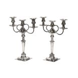 A pair of early 20th century plated three light candelabra.