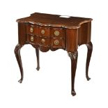 A continental style serpentine fronted chest of two drawers,