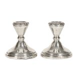 A pair of Adie Brothers Limited Birmingham silver chamber candlesticks, 1958, loaded. Height 10.