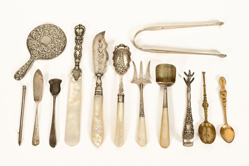 A collection of silver and plated cutlery and other items,