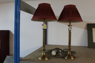 Pair of column lamps with red shades