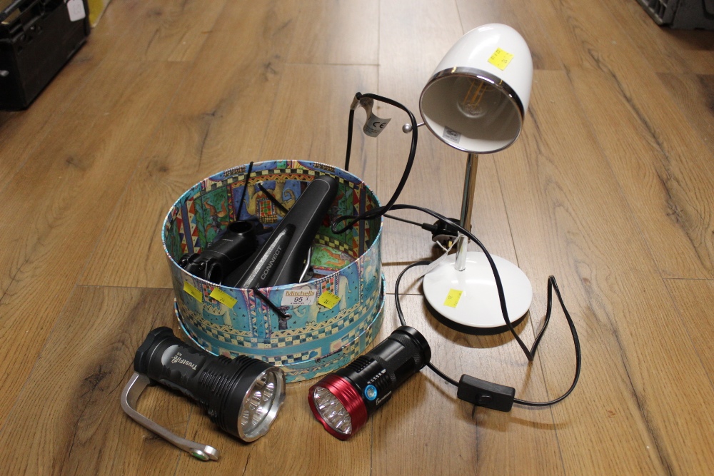 Desk lamp and box of cycling equipment including seat and handheld torches