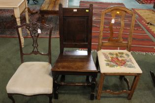 Three mismatched dining chairs