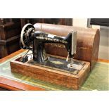 Singer hand cranked sewing machine in bentwood case