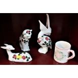 Three Plichta animal figures and pottery mug
