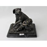 Metal sculpture of a sleeping child and protective dog on marble base