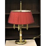 Brass lamp base with four bulbs and red shade