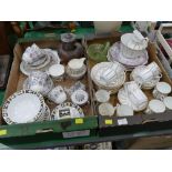 Two boxes of china part tea sets, stoneware jug, glass basket,