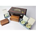 Wooden case containing three Reuge music boxes and two other wooden music boxes