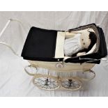 Child's silver cross pram with cream body and interior and soft bodied doll