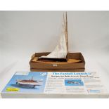 Small model skiff and boxed handmade fan tail launch,