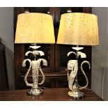 Pair of ornate beaded lamps with matching shades,