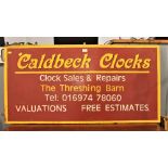 Vintage handpainted wooden sign "Caldbeck Clocks",