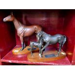 Two Beswick Connoisseur Models - Red Rum and Black Beauty and foal