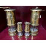 Pair of miniature brass miners lamps commemorating Haig Colliery dated 1916-1986 and pair of larger