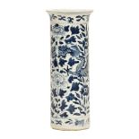 A 19th century blue and white spill vase, decorated with dragons and four character mark to base.