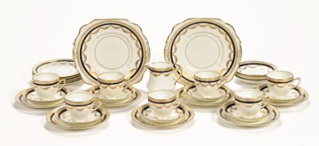 An Edwardian Diamond China Limited part tea service, 7 cups, 12 saucers, 12 side plates,