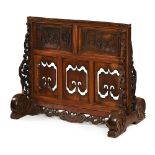 A large Chinese carved hardwood floor screen stand. Height 79 cm, width 94 cm, depth 52 cm.
