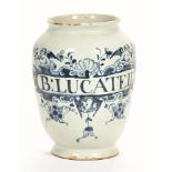 An early 18th century Delft ware blue and white floral decorated and inscribed apothecary jar. 18.