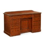 A Victorian mahogany dressing table with nine drawers and recessed cupboard,