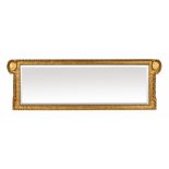 A George III gilt overmantle mirror, with scrolled ends,