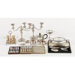 A pair of silver plated candelabra, a plated tea service, entree dish, egg cruet etc.