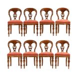 A set of eight Victorian style balloon back dining chairs, with fluted and turned front legs.