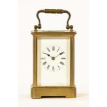 An Edwardian brass carriage clock, timepiece only. Height 12.3 cm.