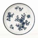 An 18th century English blue and white porcelain shallow dish. Diameter 21 cm.
